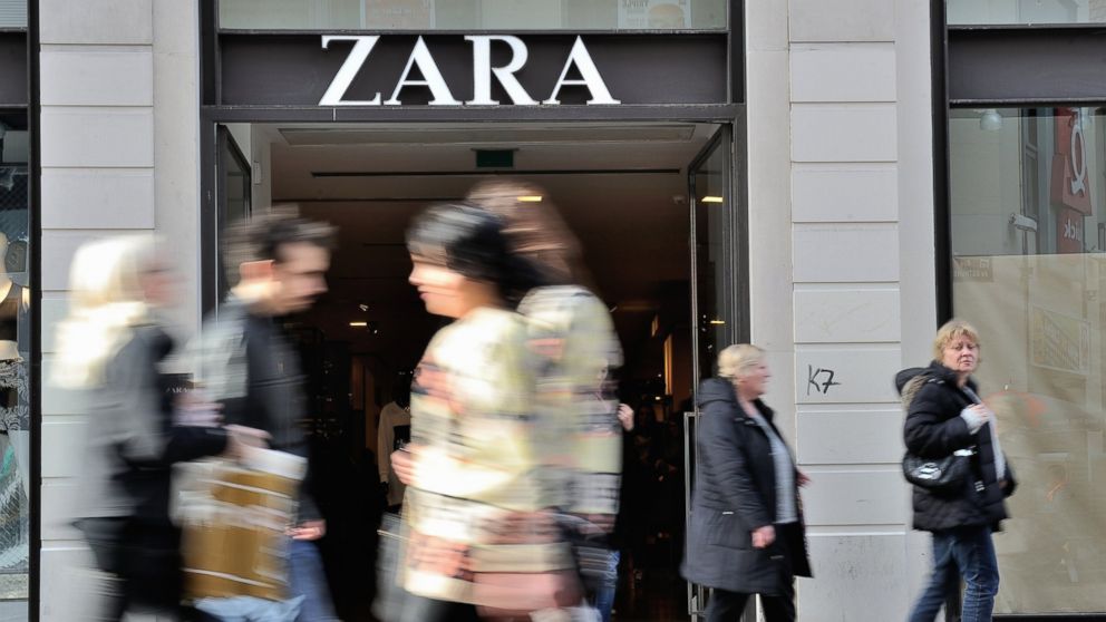 PHOTO: People walk in front of the entrance of a Zara clothing store on Feb. 24, 2014 in the French northern city of Lille.  