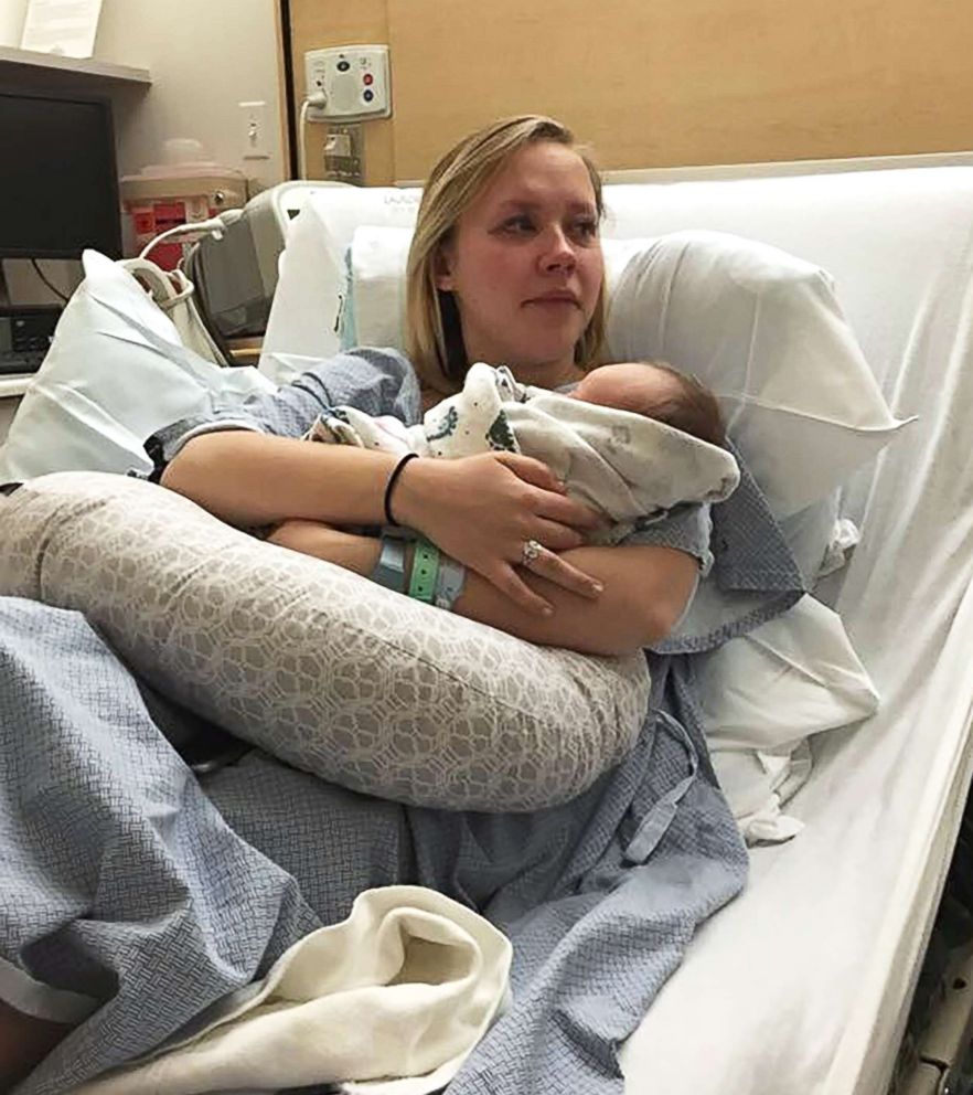PHOTO: Hannah Mongie, of Provo, Utah, holds her son Taggart Kaden Marsh after his birth.