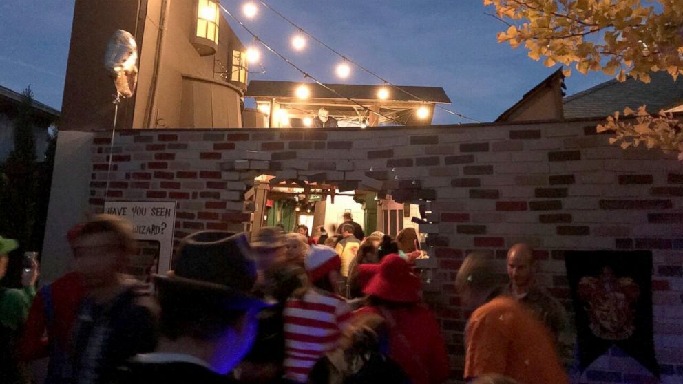 PHOTO: On Halloween night, hundreds of children and adults entered through a magic brick wall to see the spellbinding setup. 