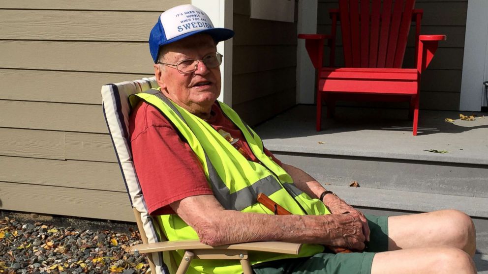 World War II veteran Harvey Djerf relaxes in a chair placed in the yard of Tom and Melanie Heuerman, his neighbors in Plymouth, Minnesota.