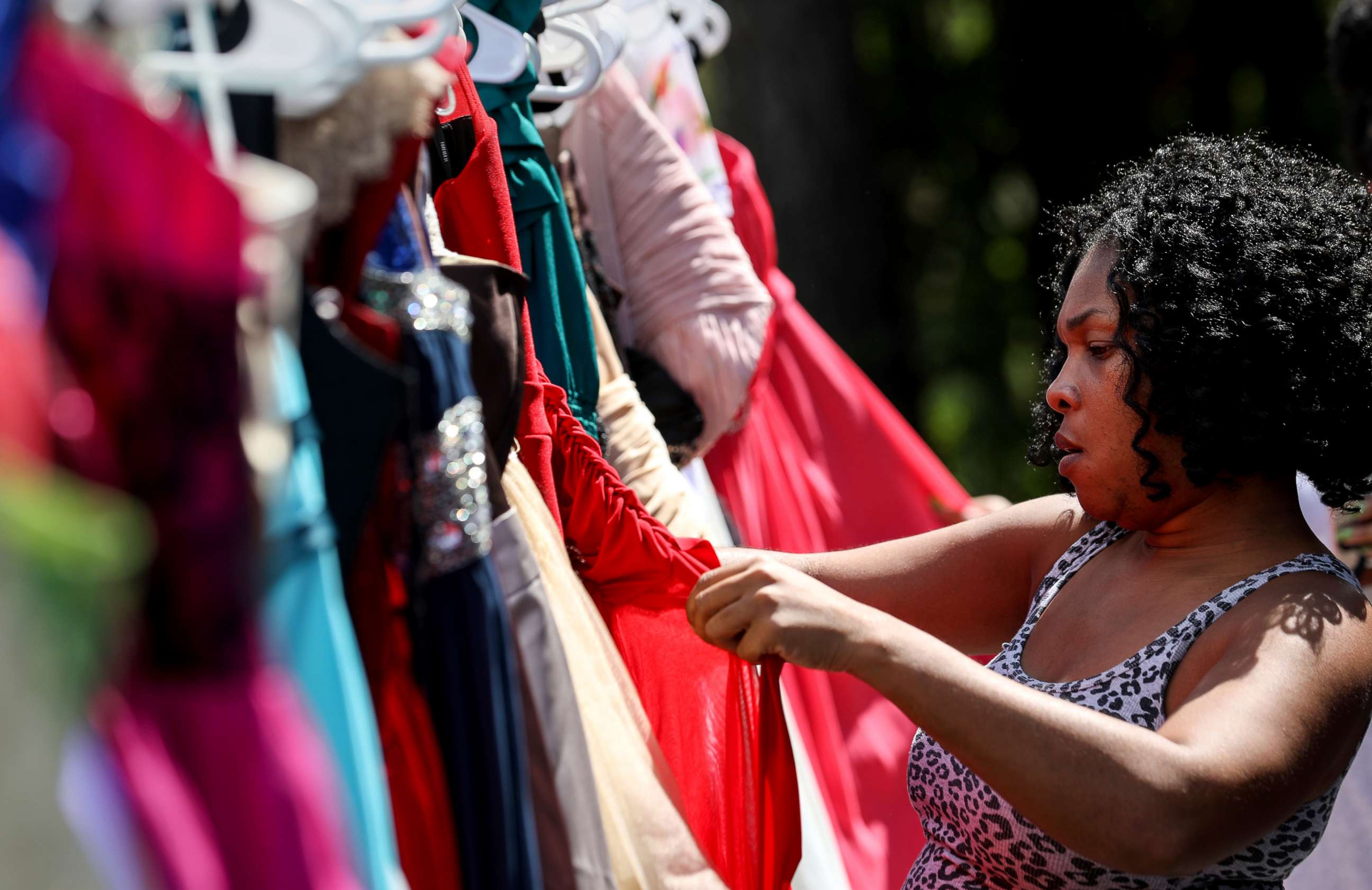PHOTO: Shyra Moody looks for a homecoming dress for the daughter of a friend who lost everything in Hurricane Harvey, at the home of Tammy Reel, Sept. 24, 2017, in Spring, Texas.