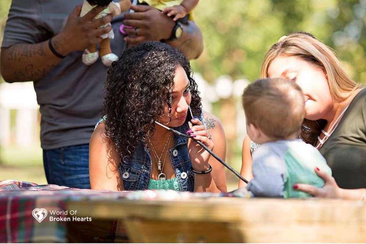 PHOTO: Lacey Tiara Wilcox listens to her daughter's heart inside the chest of 2-year-old Mason Perkins. 