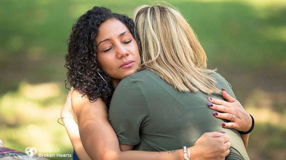 PHOTO:Lacey Tiara Wilcox of Avon, Ind. and Angela Perkins of Jellico, Tenn. embrace as they meet face-to-face for the first time on Sept. 25, 2017 at Centennial Park in Nashville.
