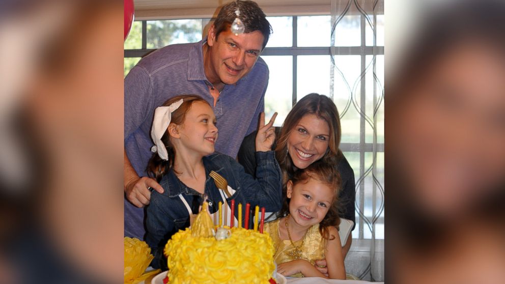 PHOTO: Kristen Hewitt with her husband and two daughters. 