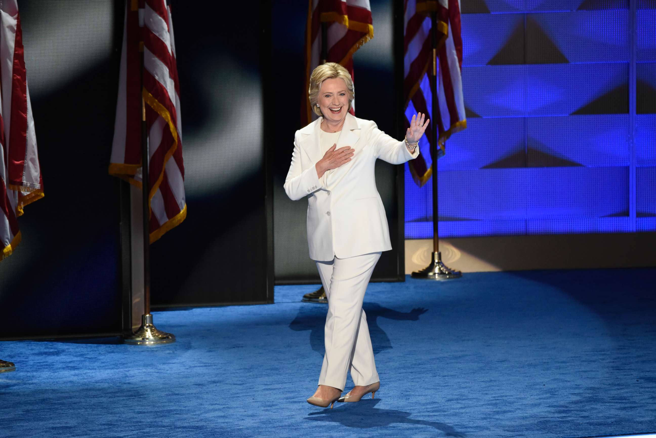 PHOTO: Hillary Clinton, wearing a white pantsuit, takes the stage to accept the Democratic nomination for president, July, 28, 2017 in Philadelphia. 