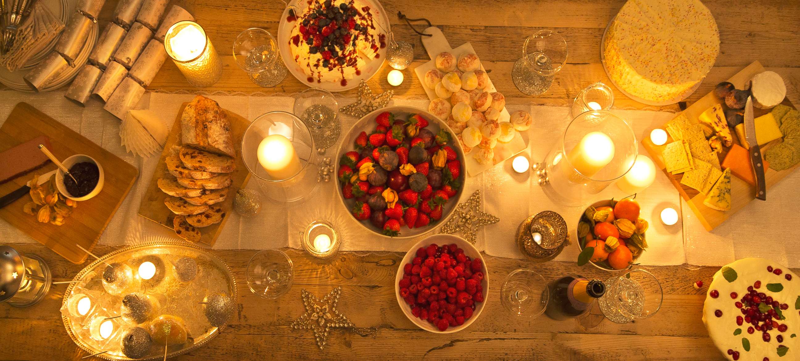 PHOTO: Overhead view of a candlelight table with Christmas desserts in this undated stock photo.