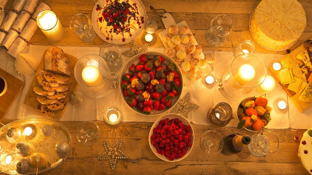 PHOTO: Overhead view of a candlelight table with Christmas desserts in this undated stock photo.