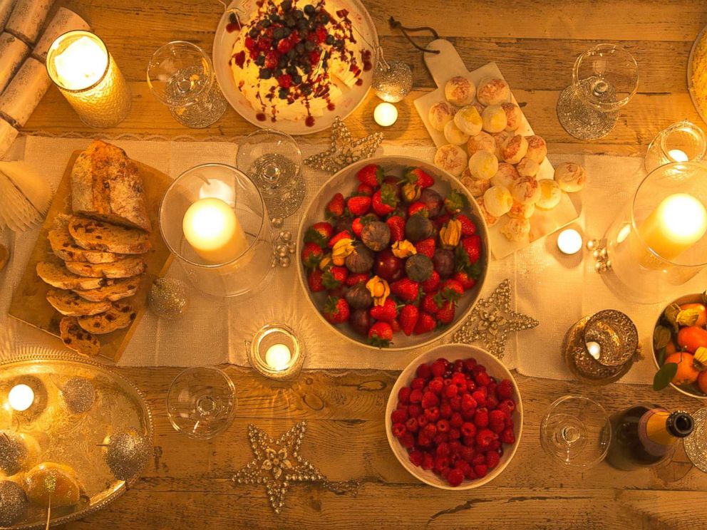 PHOTO: Overhead view of a candlelight table with Christmas desserts in this undated stock photo.