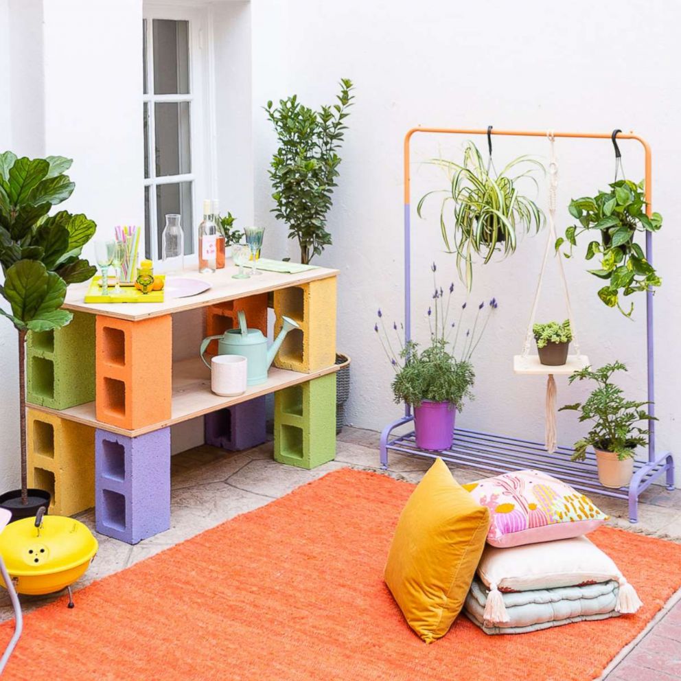 PHOTO: Learn step-by-step from Brit + Co how to make a bar out of cinder blocks and a clothing rack planter.