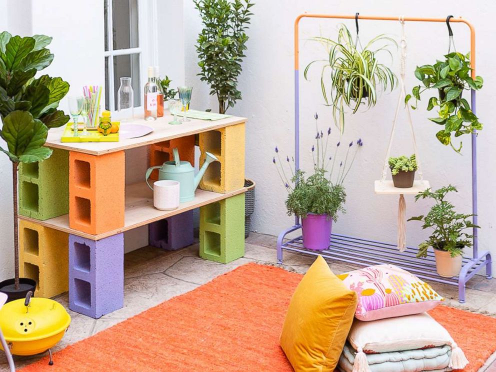 PHOTO: Learn step-by-step from Brit + Co how to make a bar out of cinder blocks and a clothing rack planter.