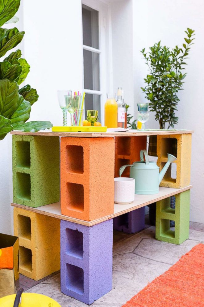 PHOTO: Learn step-by-step from Brit + Co how to make a bar out of cinder blocks and a clothing rack planter.