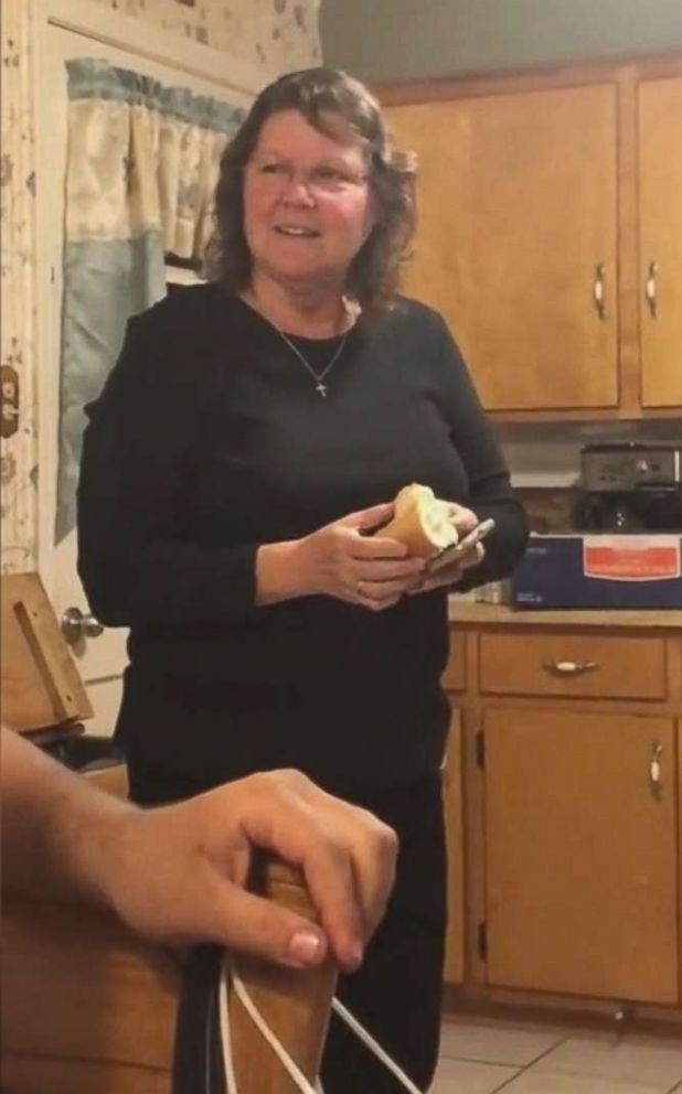 PHOTO: Cynthia Dozier holds a hot dog bun her son and daughter-in-law put in an oven to reveal their pregnancy.