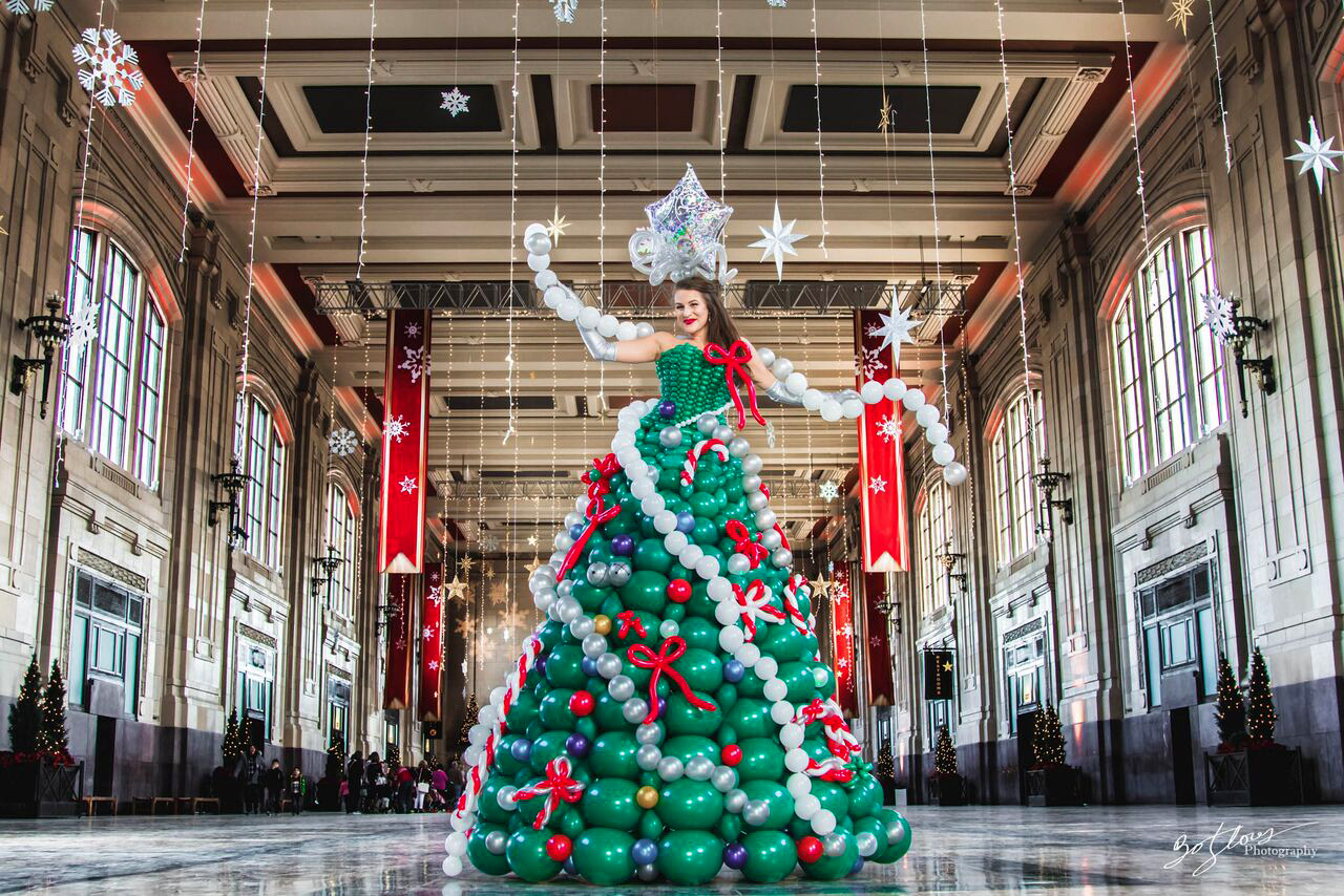 PHOTO: "Molly Balloons," of Kansas City, made an elaborate Christmas tree dress out of balloons.