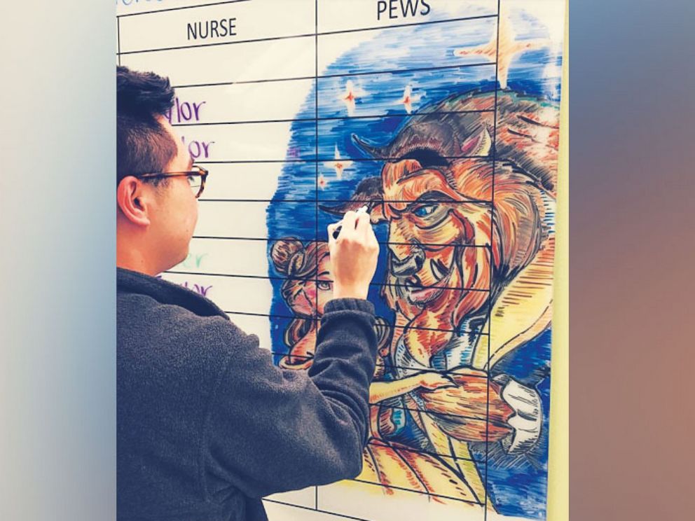 PHOTO: Edgar Palomo, a nurse on the hematology/oncology floor at Cook Children's Medical Center, draws dry-erase artwork to cheer up the young patients. 