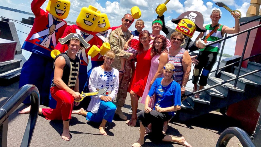 The Cruz and Collier families with Lego soldiers after Sgt. Tom Cruz surprised everyone on July 4 at Legoland in Florida.