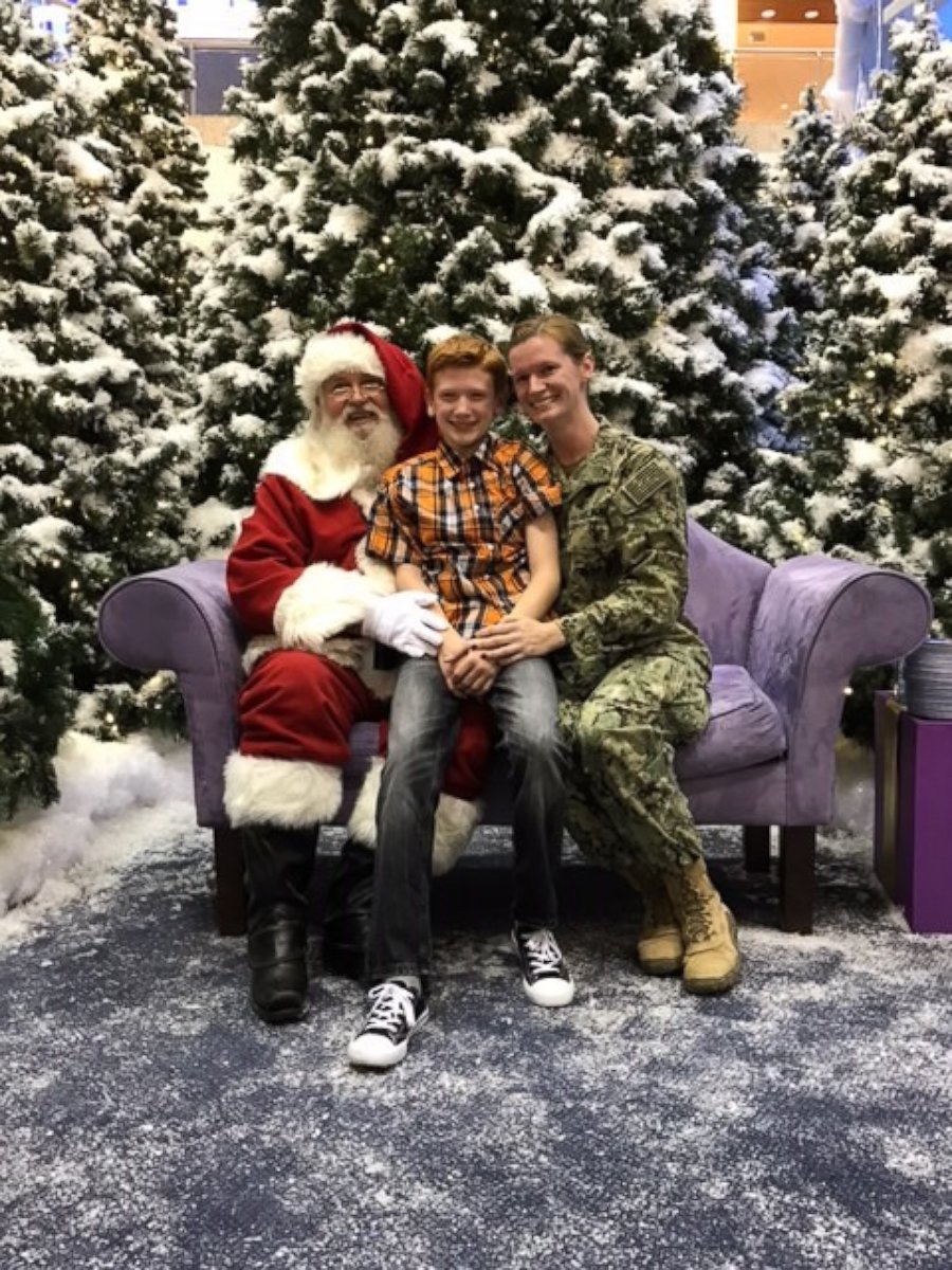 PHOTO: Julie Workman, a Petty Officer in the Navy, surprised her son home from deployment while he was taking a photo with Santa.