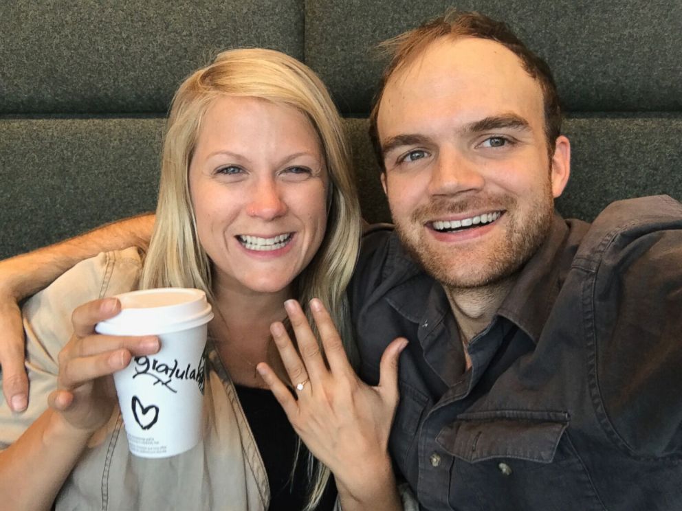 PHOTO: Esther Havens and Austin Mann smile after becoming engaged in a Starbucks at the Amsterdam Airport Schiphol years after Mann left her a note hidden in the store. 