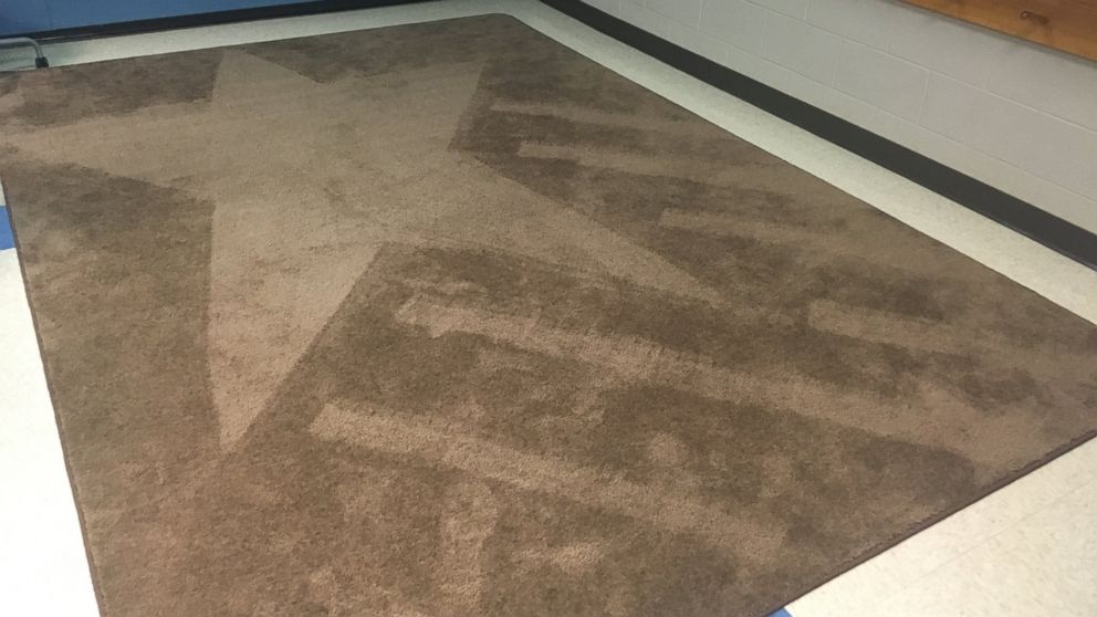 PHOTO: School janitor Ron Munsey vacuums artistic designs into classroom rugs as daily surprise for kids.
