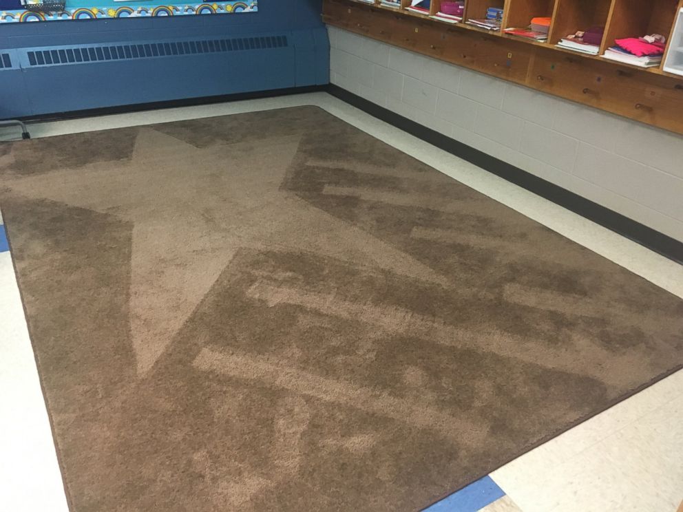 PHOTO: School janitor Ron Munsey vacuums artistic designs into classroom rugs as daily surprise for kids.