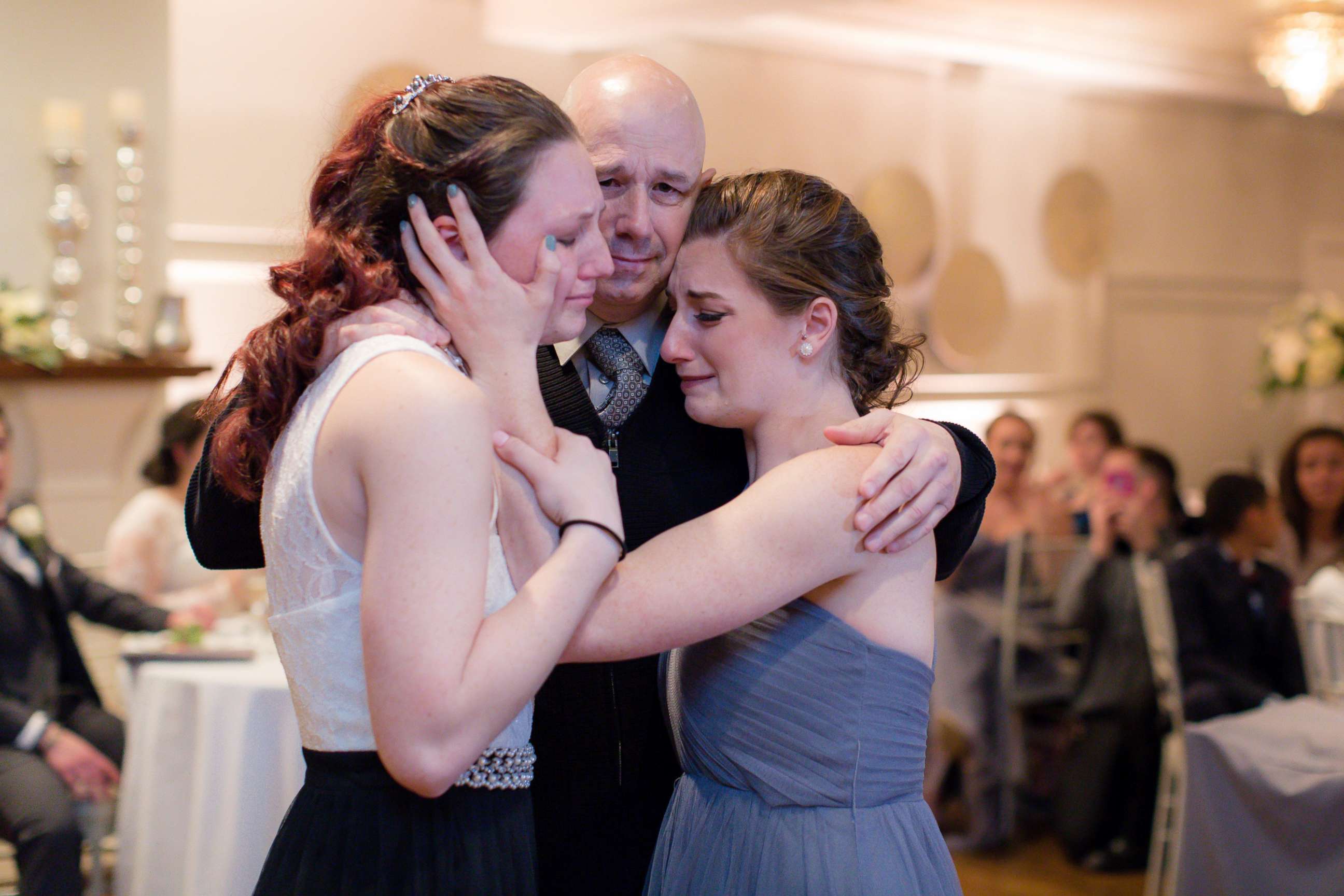 PHOTO: Jessica Otto and her sister with their dad, Peter Otto, at the wedding of their friend Michaela Cook-Yotts. 
