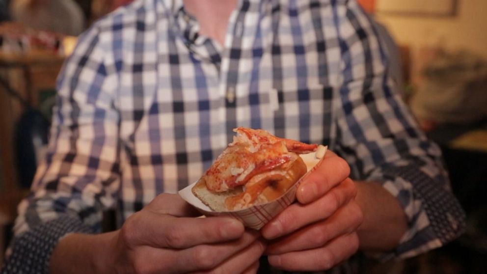PHOTO: Luke Holden from Luke's Lobster holds his traditional Maine style lobster roll. 