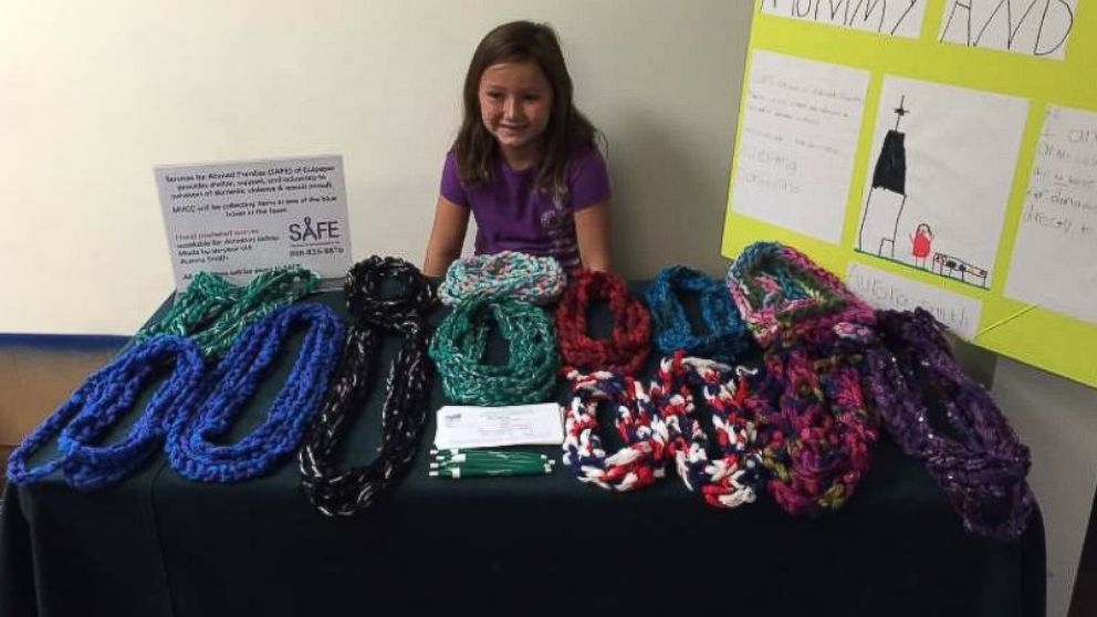 Six-year-old Aurora Smith started Mommy and Me, to make and sell scarves to help abused families. 