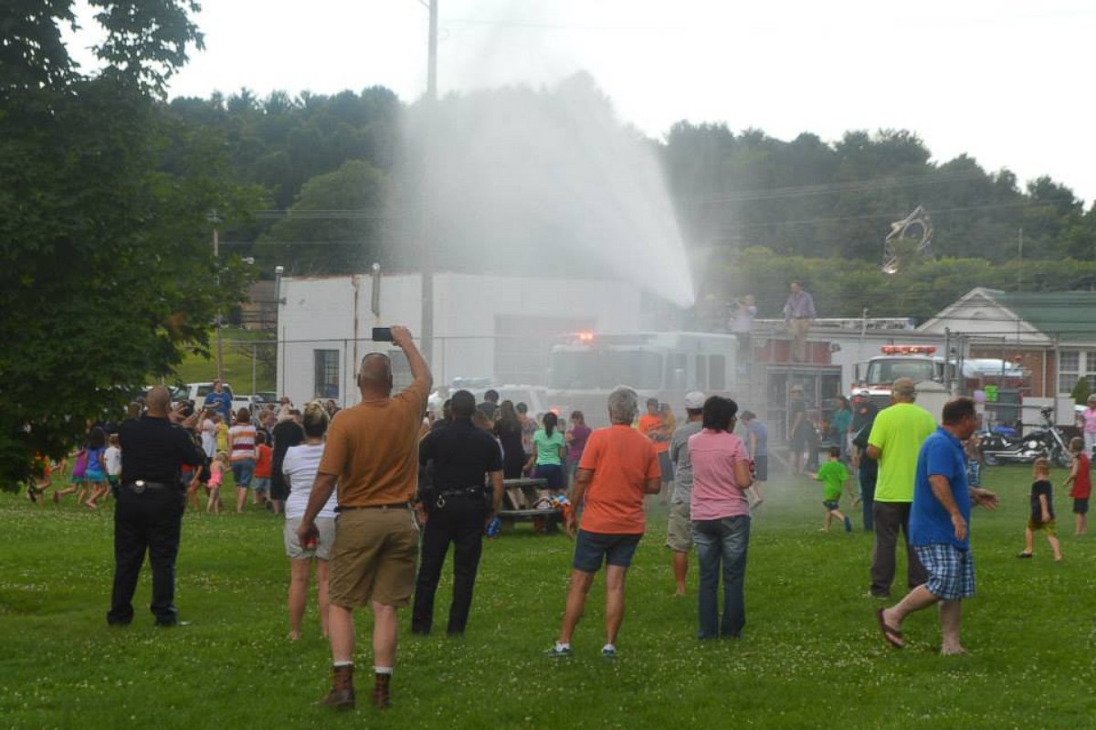 PHOTO: The local fire department sprayed the kids with the hose prior to a water balloon fight. 