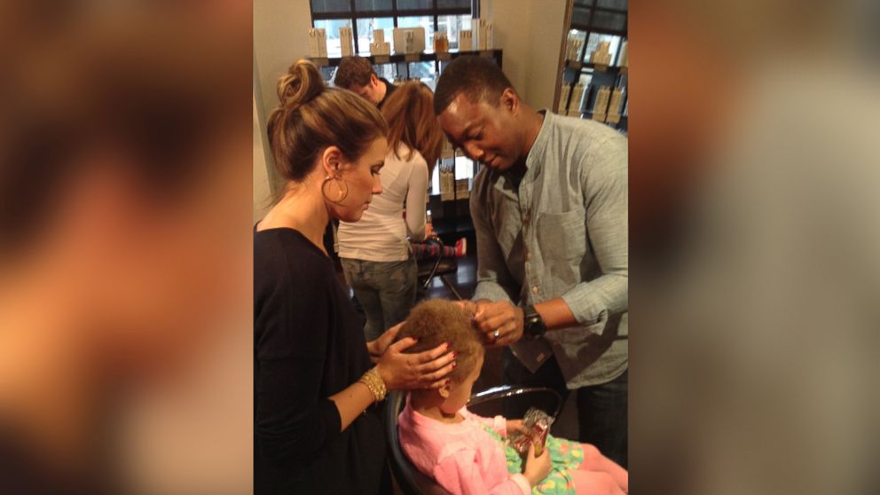 PHOTO: Owner Calli Huebl-Bodilis offers a "beer and braids" class at her Denver salon for dads. 