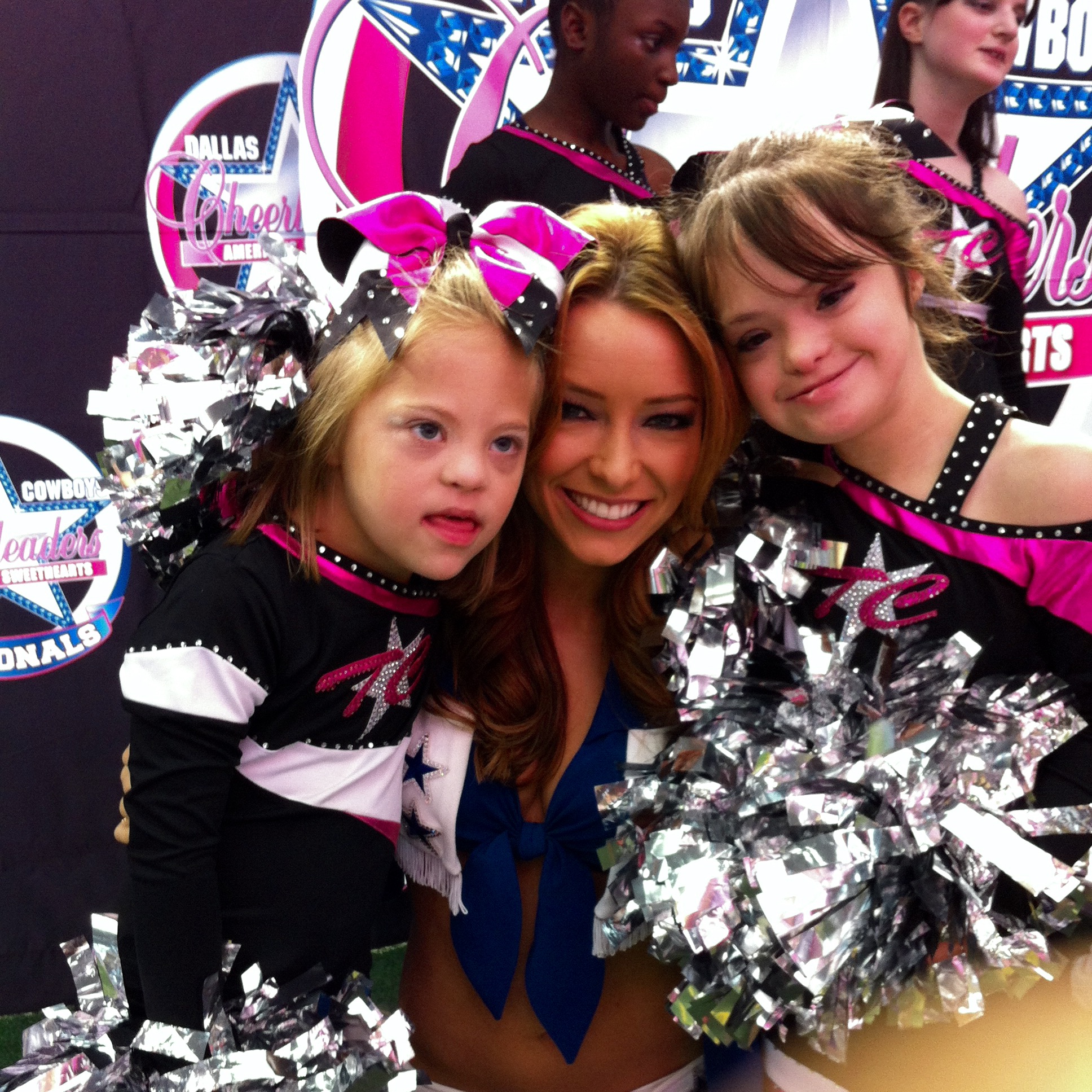 PHOTO: Katie Longwroth, right, pictured here with her friend Casey and a Dallas Cowboy cheerleader. 