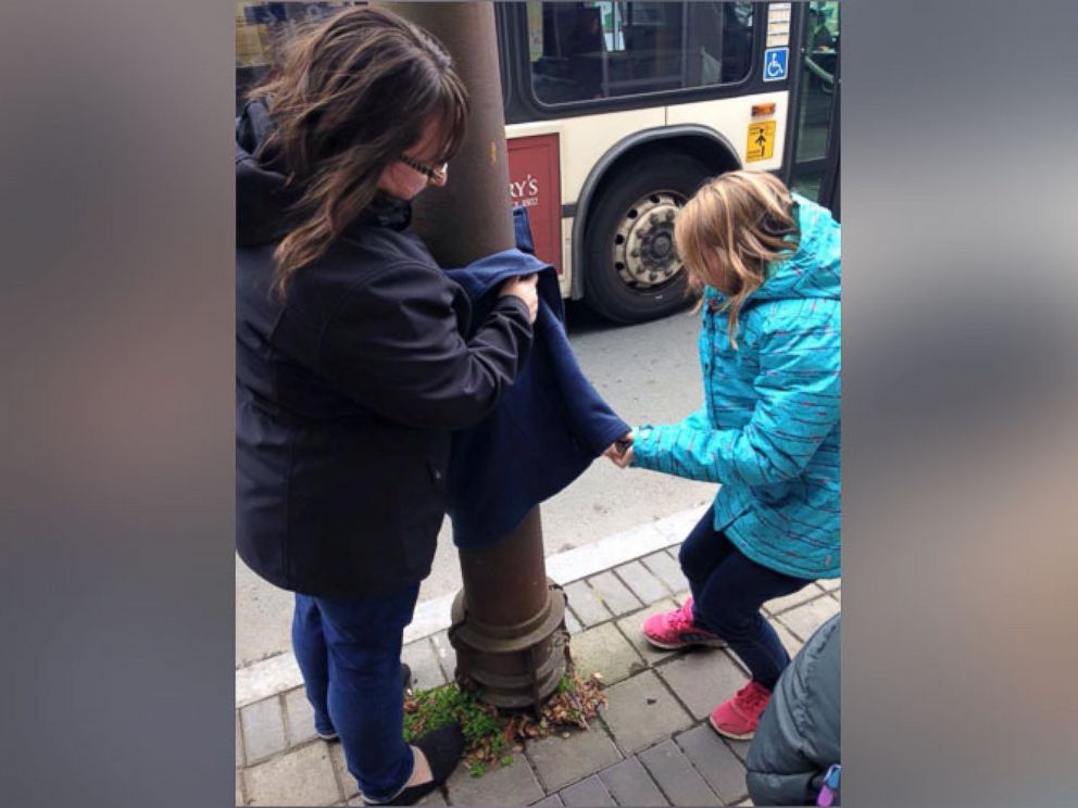 PHOTO: Tara Smith-Atkins, along with family and friends, created an outreach program in Halifax, Nova Scotia, by placing warm coats on lamp posts in the city streets. 