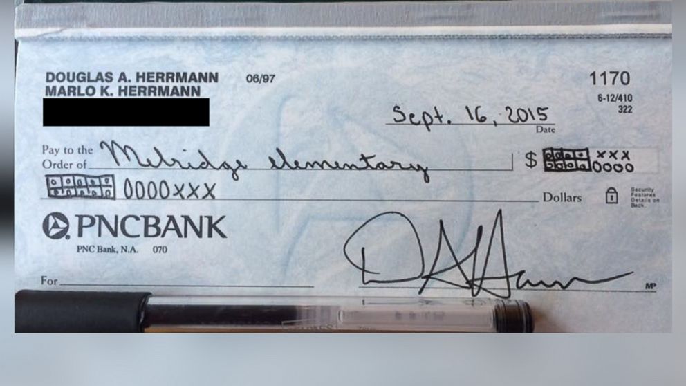 PHOTO: Doug Herrmann wrote a check to his son's school using the common core teaching strategy. 