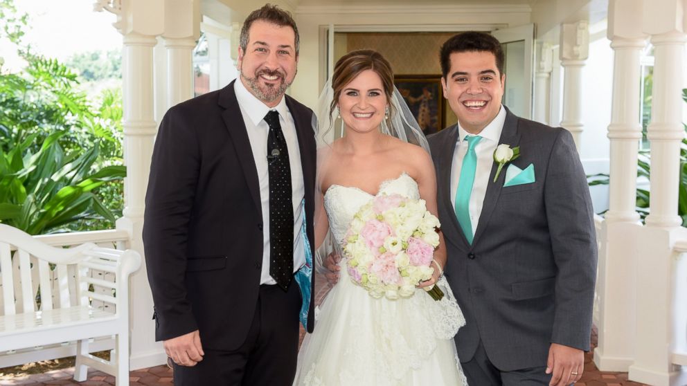 PHOTO: Joey Fatone poses with newlyweds after their Disney Fairytale wedding in Orlando.