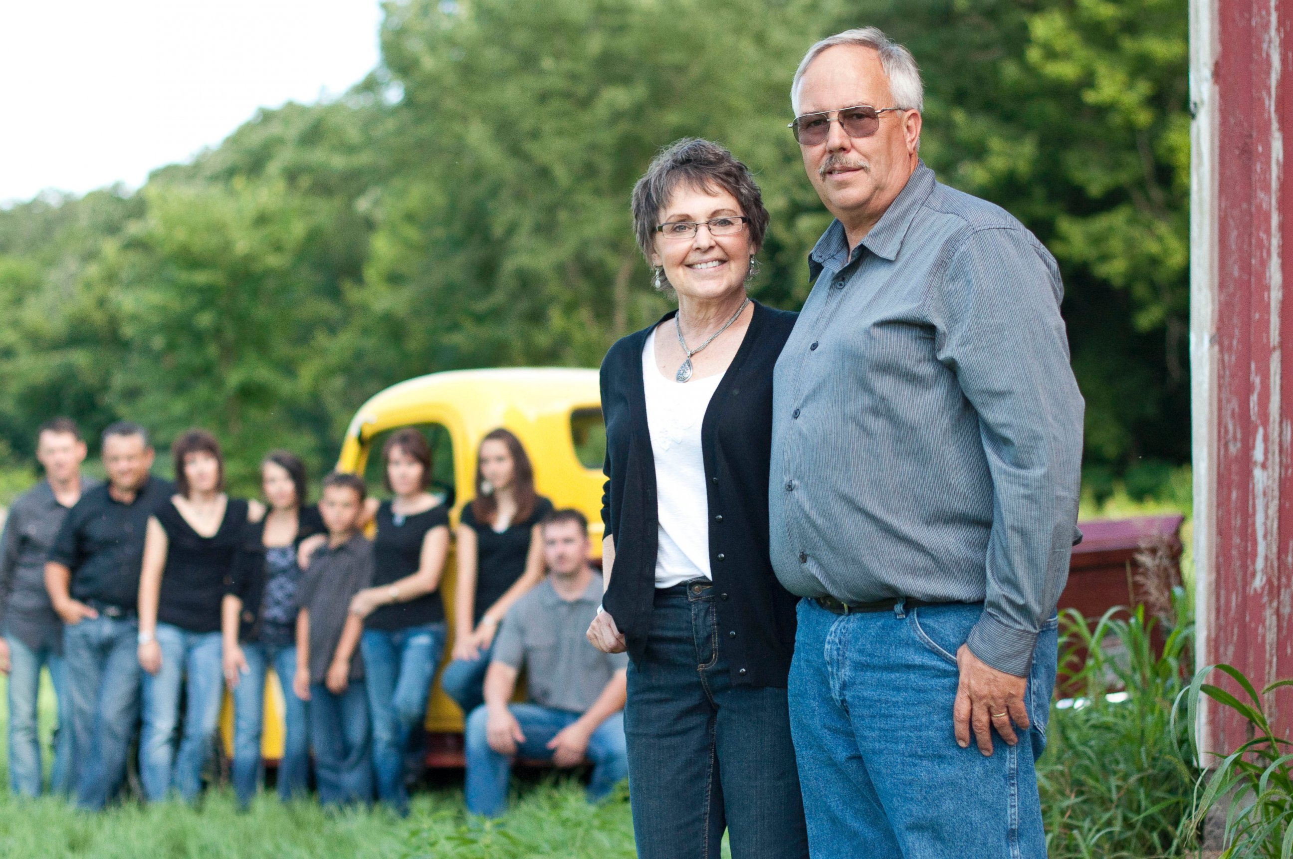 PHOTO: Don and Babbette Jaquish stand in their sunflower field with their family in the background in a photo taken in 2011.