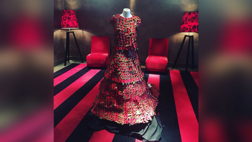 Woman handcrafts gorgeous gown out of 3,000 poppy flowers.