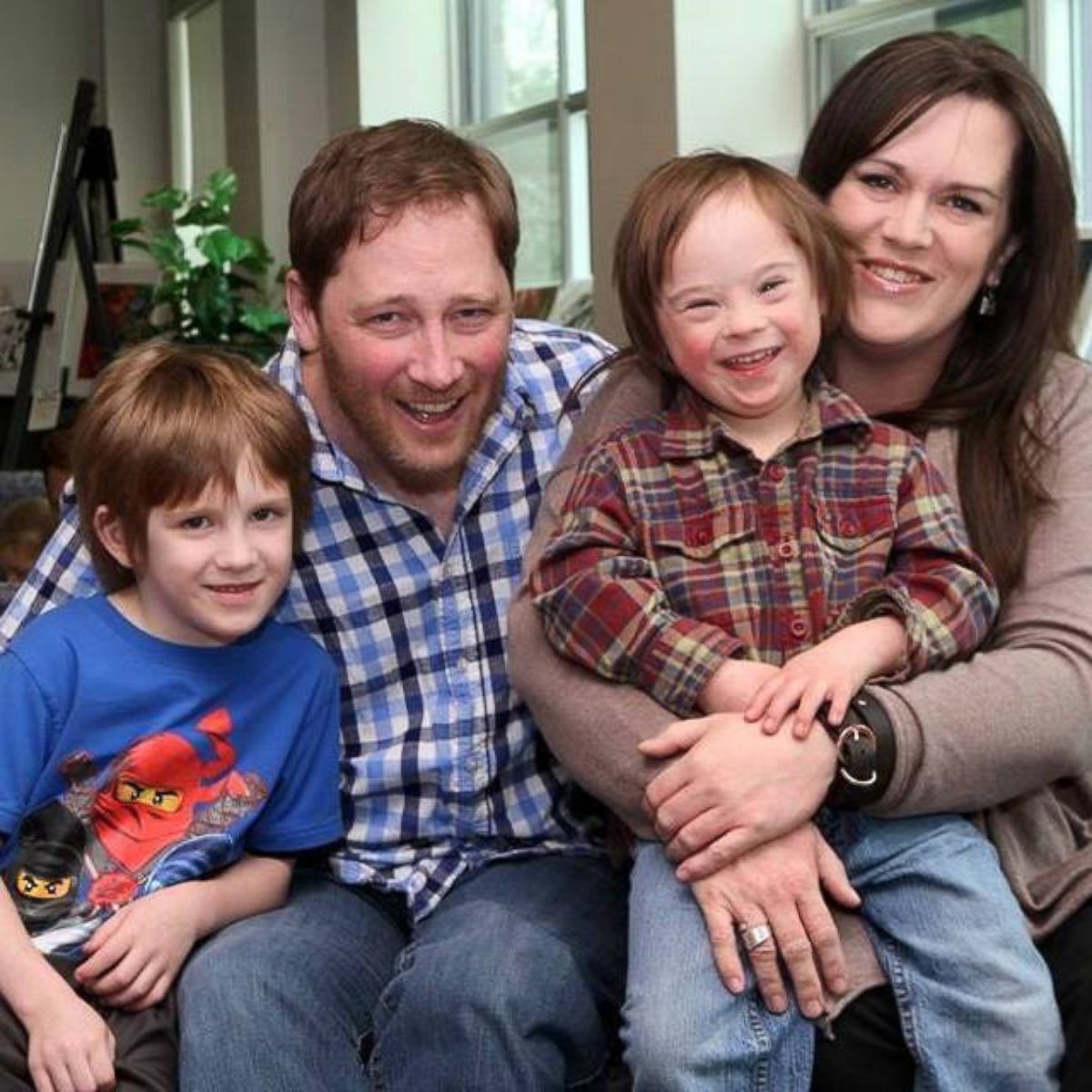 PHOTO: Robb Scott photographed with his wife, Kelly MacIntosh-Scott, and their sons Griffin,7, and Turner, 5.