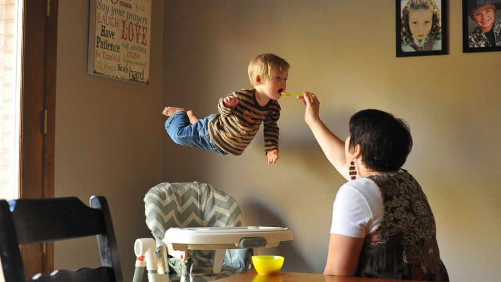PHOTO: Wil takes flight while his mom feeds him.