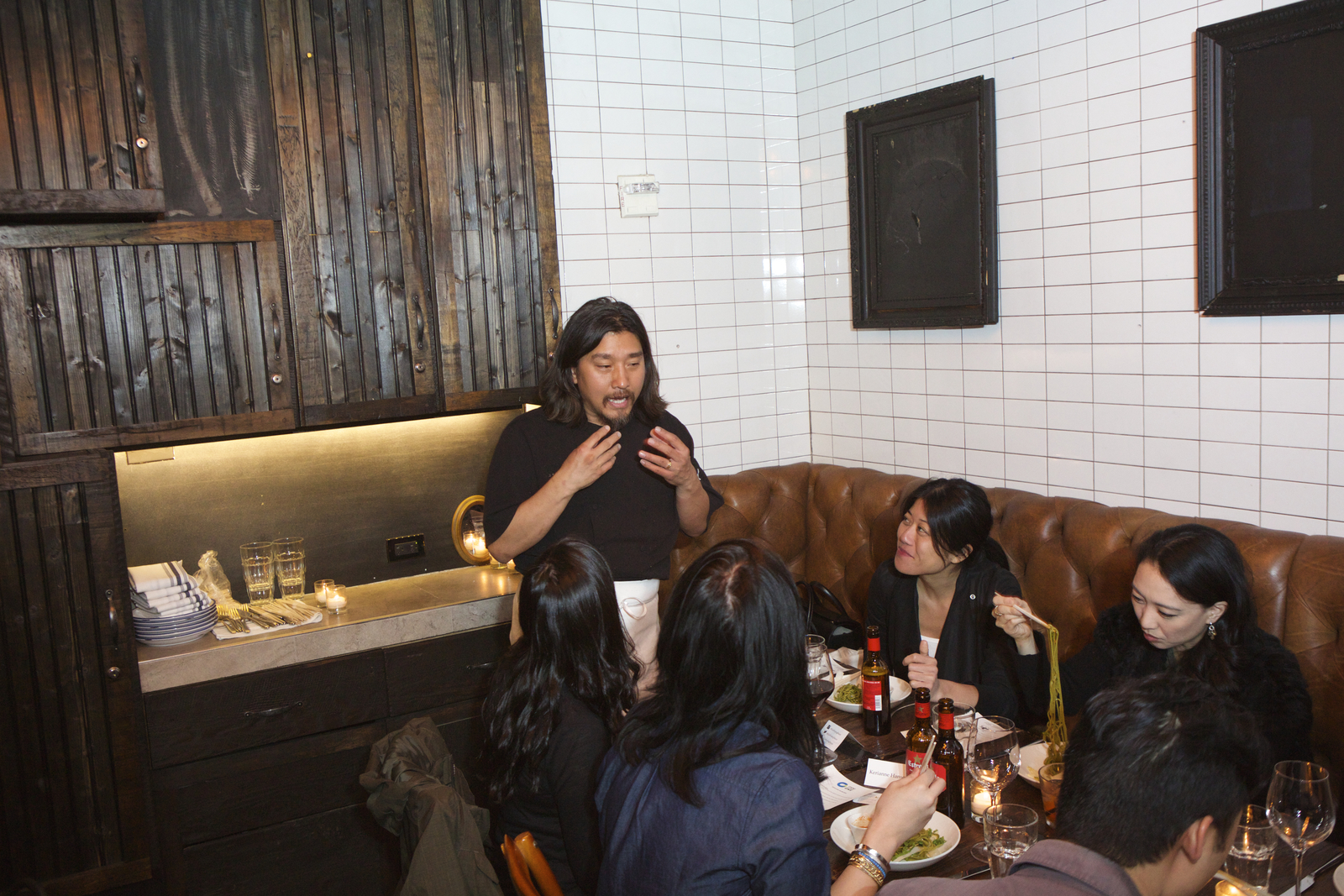 PHOTO: Chef Edward Lee describes gochujang as diners try his green tea noodles at a recent New York City event.