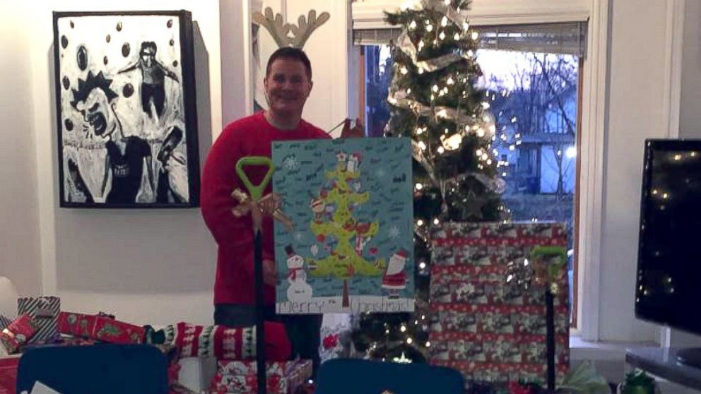 Dodd surrounded by the gifts he will deliver to one family in need.