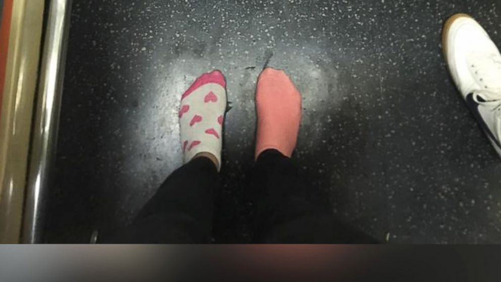 PHOTO: Kay Brown stands on a subway train in her socks, Nov. 16, 2015, after giving her shoes to a homeless woman.