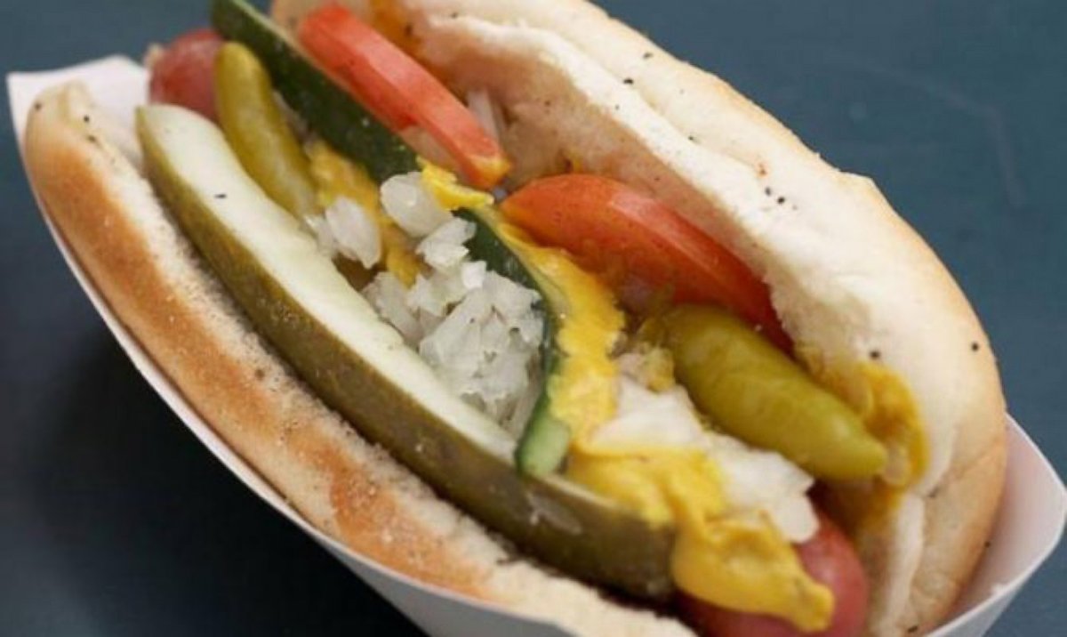 PHOTO: Chicago dogs are steamed and stuck into a poppy seed bun with mustard, pickle relish, white onions, tomato, a dill pickle spear, sport peppers, and a dash of celery salt.