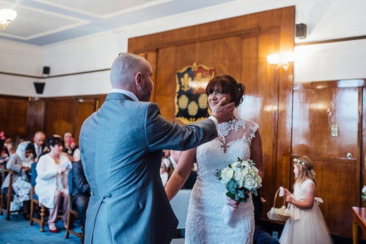 PHOTO: Joan Lyons had her head shaved for charity at the reception following her wedding with Craig Lyons in Liverpool, England.
