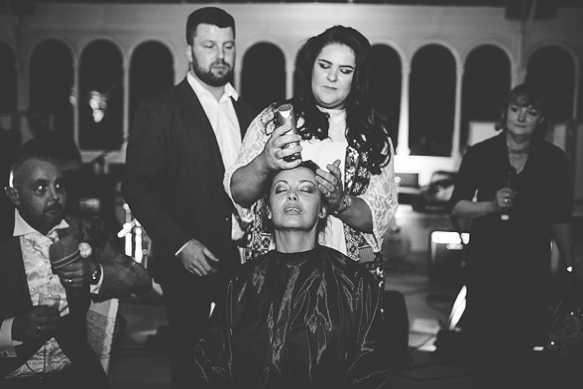 PHOTO: Joan Lyons had her head shaved for charity at the reception following her wedding with Craig Lyons in Liverpool, England.