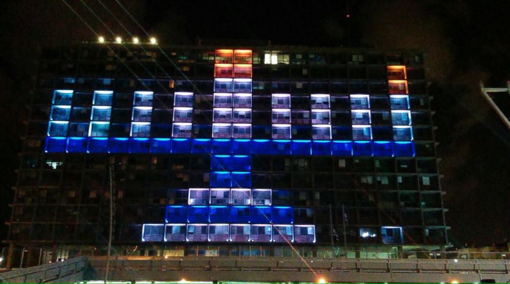 PHOTO: The city of hall of Tel Aviv, Israel's most populous city, is lit up in the shape of a Menorah. 