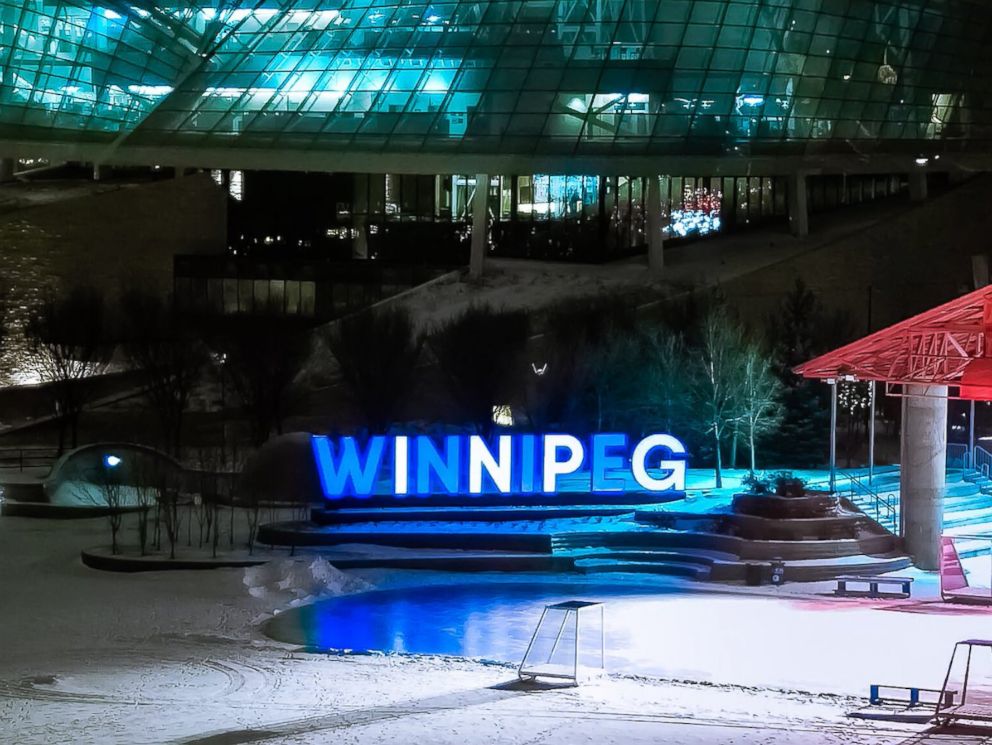 PHOTO: The iconic "Winnipeg" sign in Winnipeg, Manitoba, located at The Forks, is lit blue and white for Hanukkah on December 11, 2017.