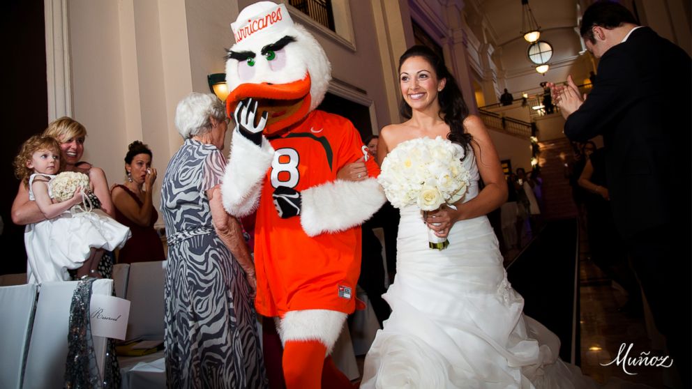 Jennifer Sullivan walked down the aisle on the arm of Miami Hurricanes' mascot Sebastian.