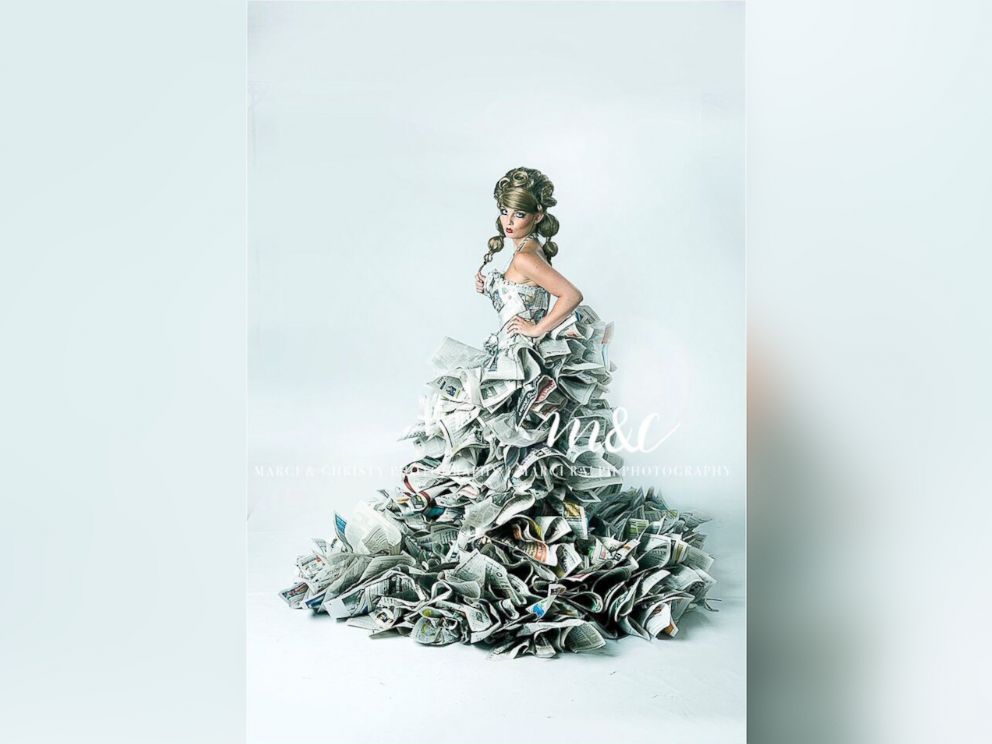 PHOTO: Marci Ralph and her daughter Christy Maiquez, of Camby, Indiana, constructed gowns made out of newspapers.