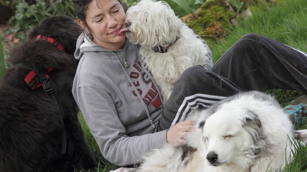 PHOTO: Owner Trisha is photographed with her dog "Magoo," a blind and deaf therapy dog.