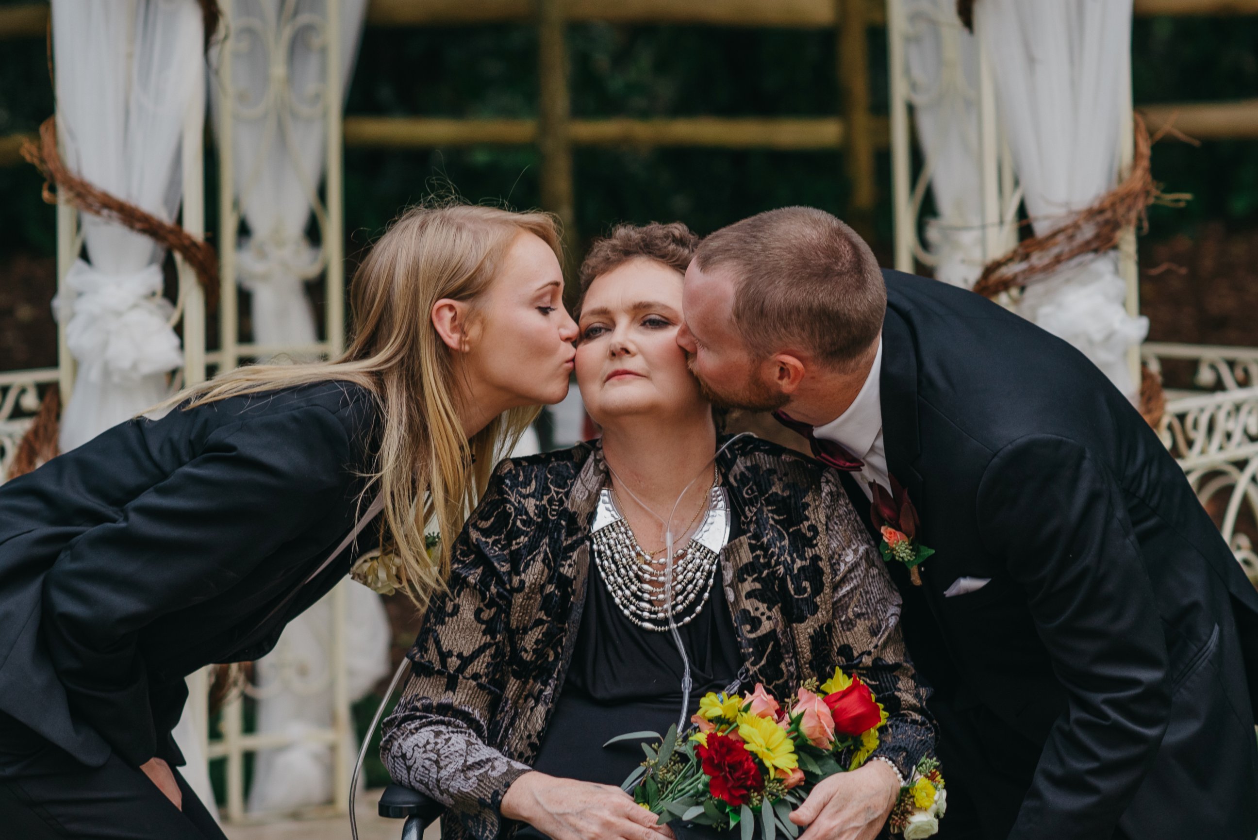 PHOTO: Tory and Tyler Crosby kissing their mother Dot on Tyler's wedding day.