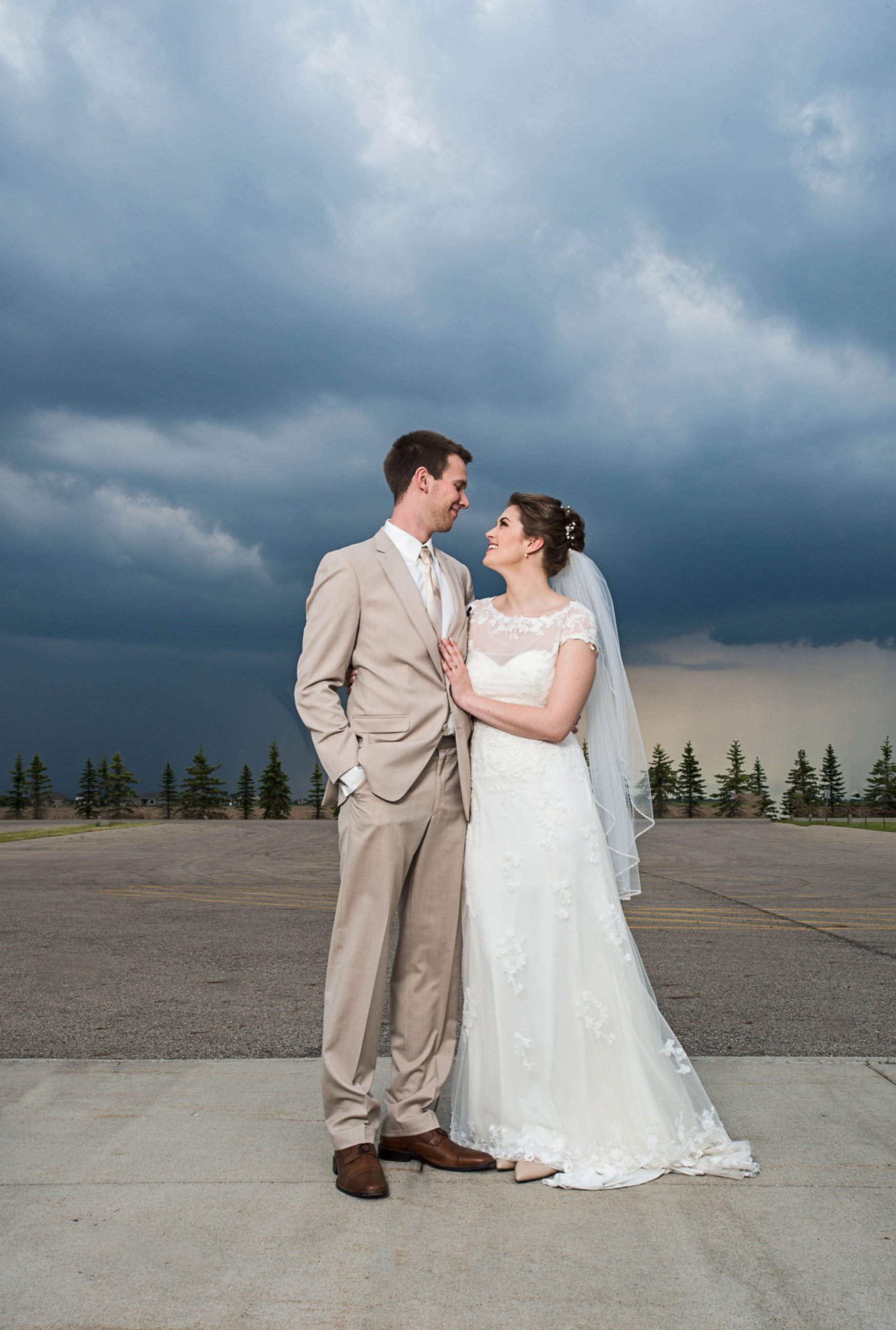 PHOTO: Kipp and Kelsey Loeslie's wedding photo includes a funnel cloud in the distance.