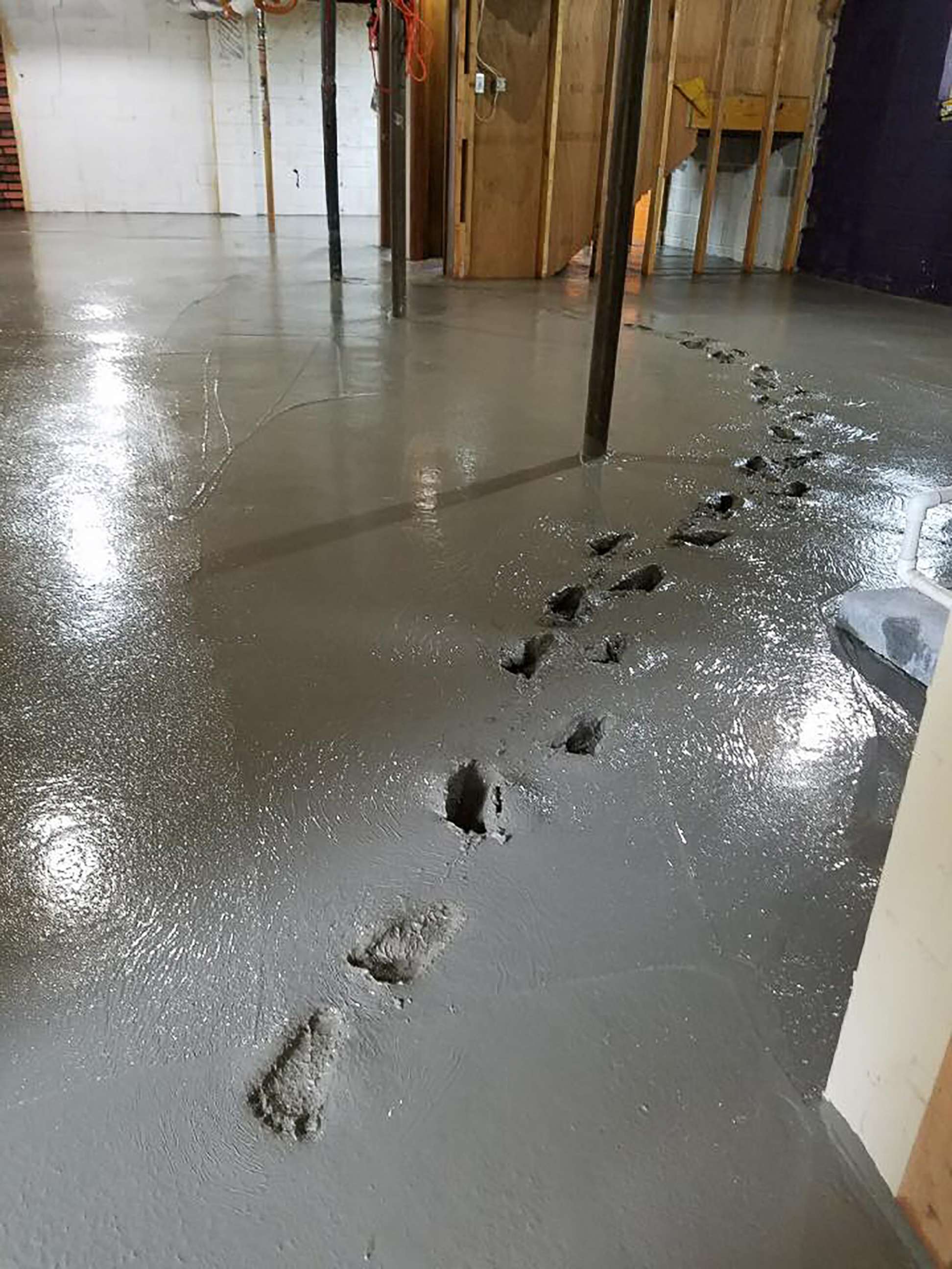 PHOTO: Izzadora Millaway, 2, of Cleveland, left her footprints in concrete that had just been poured in the home's basement during a renovation project.